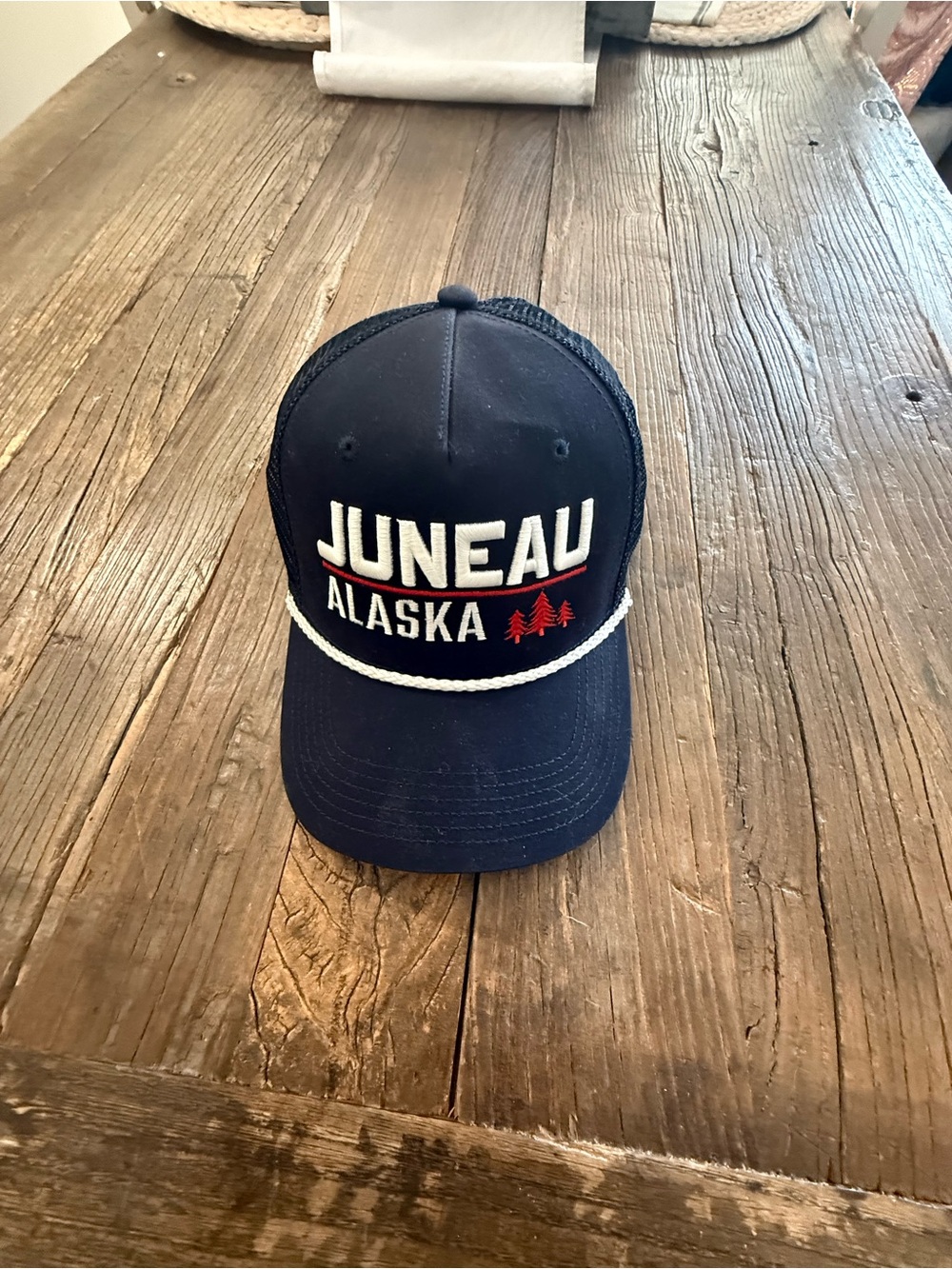 Legacy Juneau Alaska Navy Blue Hat with White Rope and Red Trees